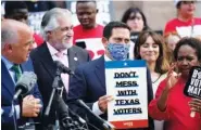  ?? AP PHOTO/ERIC GAY ?? Rep. Trey Martinez Fischer, D-San Antonio, and other Democratic caucus members join a rally on the steps of the Texas Capitol to support voting rights Thursday in Austin, Texas.