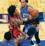  ?? John Raoux / Associated Press ?? Rockets guard Kevin Porter Jr., who had 22 points with seven assists, goes up for a shot in the first half.