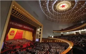  ??  ?? GREAT HALL: Delegates prepare to cast their votes Sunday during a plenary session of the National People’s Congress at the Great Hall of the People in Beijing.