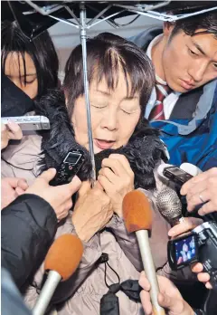  ?? AP ?? Chisako Kakehi is surrounded by reporters in Sakai, western Japan, in March last year.