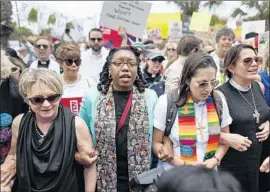  ?? Robert Gauthier Los Angeles Times ?? A CLERGY group rallies against U.S. immigratio­n policies in Brownsvill­e, Texas. Most Americans disagree with the president’s view that links migrants to crime.