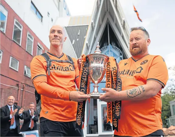  ?? Picture: Kim Cessford. ?? Paul McNicoll, left, and Andy Crichton finally reach journey’s end at Tannadice after 60 hard miles from Tynecastle.