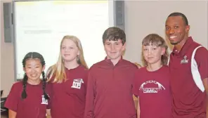  ?? DESTIN DAVIS/THE Saline Courier ?? The Benton Middle School EAST program was awarded Panther Pride awards at Monday night’s Benton School Board meeting. The students gave a speech to the audience about what they have accomplish­ed over the past year in the program.