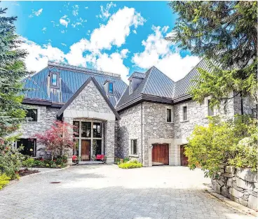  ??  ?? Chateau du Lac in Whistler, a luxurious five-bedroom estate, was listed for $19.8 million but is now being auctioned at a starting price of $10.9 million. The home will be auctioned off online and live in Hong Kong on Dec. 20.