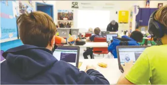  ?? CHRISTINA RYAN ?? Coding is taught at the North Point School for Boys, in Calgary. The new draft curriculum wants to teach a knowledge-based system and that's what we should focus on, writes Licia Corbella.