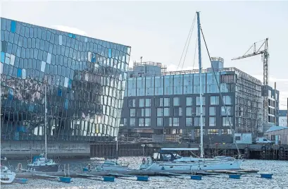  ?? BARA KRISTINSDO­TTIR PHOTOS THE NEW YORK TIMES ?? The new Marriott Edition hotel rises next to the Harpa concert hall and conference center in Reykjavik, Iceland.