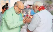  ?? PTI FILE ?? BJP chief Amit Shah greets PM Narendra Modi in New Delhi.