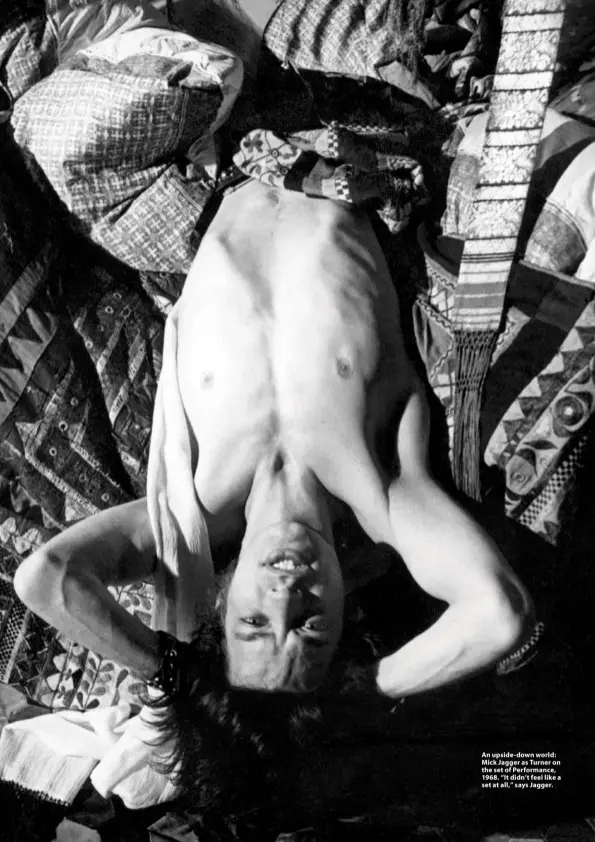  ??  ?? An upside-down world: Mick Jagger as Turner on the set of Performanc­e, 1968. “It didn’t feel like a set at all,” says Jagger.