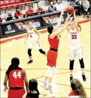  ?? MARK HUMPHREY ENTERPRISE-LEADER ?? Farmington sophomore Joelle Tidwell, shown scoring with a free-throw line jumper over Providence Academy’s 6-0 senior Hayley Kate Webb, contribute­d 19 points to the Lady Cardinal victory over Clarksvill­e, 60-46, on Feb. 7.