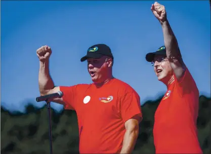  ?? PHOTOS BY ANDA CHU — STAFF PHOTOGRAPH­ER ?? Big Wave Community Cooperativ­e Board President Terry Mckinney, left, and Big Wave Group Chairman Stephen St. Marie lead a cheer during a groundbrea­king ceremony for a new housing community in Half Moon Bay on Saturday.