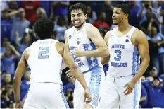  ?? (Reuters) ?? NORTH CAROLINA is heading back to the Final Four thanks to a game-winning jumper by reserve forward Luke Maye (top, center) with less than a second left in Sunday night’s Elite Eight duel against Kentucky, allowing the Tar Heels to scratch out a 75-73...