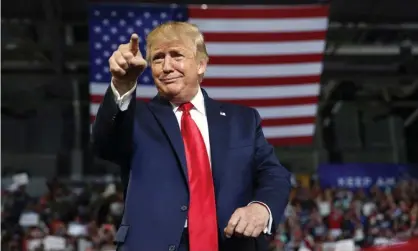  ?? Photograph: Carolyn Kaster/AP ?? Donald Trump gestures to the crowd as he arrives to speak at a campaign rally in July 2019.