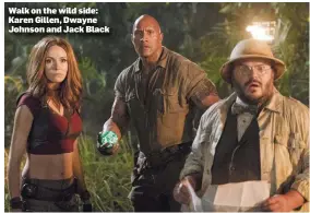  ??  ?? Walk on the wild side: Karen Gillen, Dwayne Johnson and Jack Black