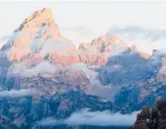  ?? KAREN BLEIER/GETTY-AFP2012 ?? The sun hits the tips of the Grand Tetons in Grand Teton National Park.