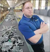  ?? JOHN SMIERCIAK/CHICAGO TRIBUNE ?? Brian Brundage, CEO of Intercon Solutions in Chicago Heights, stands by numerous parts taken from various computer hard drives in 2007. He has pleaded guilty to his role in an electronic waste fraud scheme.