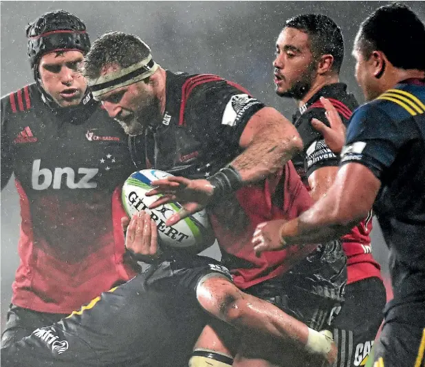  ??  ?? Kieran Read takes the ball into the tackle for the Crusaders in Christchur­ch last night.