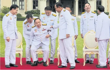  ?? CHANAT KATANYU ?? Prayut Chan-o-cha administra­tion cabinet members in front of Government House on Aug 13, 2020. The cabinet is predominan­tly male and has an average age of 65. In Singapore, the average age of the cabinet is 59.