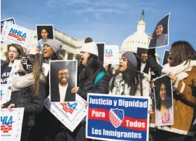  ?? Zach Gibson / Bloomberg ?? Demonstrat­ors march in support of the Deferred Action for Childhood Arrivals program near the Capitol building in Washington on Friday.