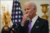  ?? ALEX BRANDON — THE ASSOCIATED PRESS ?? President Joe Biden pauses as he speaks about the coronaviru­s, accompanie­d by Vice President Kamala Harris in the State Dinning Room of the White House, Thursday, Jan. 21, in Washington.