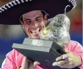  ??  ?? ACAPULCO: Spain’s Rafael Nadal Rafael Nadal wearing a sombrero holds the trophy after winning the Mexican Tennis Open ATP final match against USA’s Taylor Fritz during the Mexico ATP Open men’s singles tennis final in Acapulco, Guerrero state. — AFP