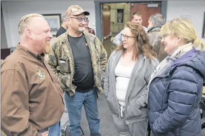  ?? MITCH MACDONALD/THE GUARDIAN ?? President of the P.E.I. Provincial Rifle Associatio­n Dave Hanson, from left, chats with Larry Sherren, Susan Mullen and Donna Myers following an informatio­n session on proposed changes to Canadian firearms regulation­s at Stratford Town Hall Tuesday.