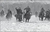  ??  ?? Herdsmen take part in a winter horse race.