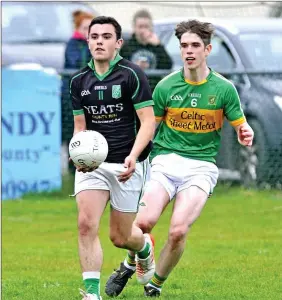  ??  ?? Tommy Henry of Curry in action with Tourlestra­ne’s Cian Surlis. Pic: Tom Callanan.