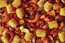  ?? FOOD STYLIST: REBECCA JURKEVICH. PHOTO BY JOHNNY MILLER/THE NEW YORK TIMES ?? Sheet-pan shrimp boil is shown in New York. A true shrimp boil is an event for a crowd, with a giant pot of bubbling water at its center.