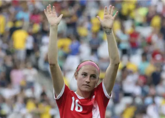  ?? PAULO WHITAKER/REUTERS ?? Janine Beckie, who has three goals in two games of the Olympic soccer tournament, says her Canadian jersey honours her family and her late father, who died of skin cancer.