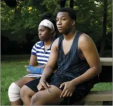  ?? ASSOCIATED PRESS ?? In this Aug. 9 photo, Keshon Williams, right, 16, displays a bullet wound on his leg alongside his sister Keishonna, 18, who was also wounded in her leg during the same shooting, in Newark, Del. After the teenagers were released from the hospital,...