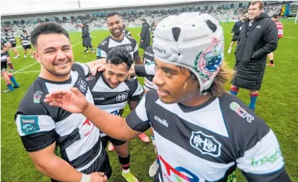  ?? Photos / Paul Taylor ?? More relief than elation as Hawke’s Bay celebrate after their nail-biting win over North Harbour.