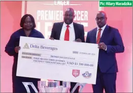  ?? Pic: Hilary Maradzika ?? Premier Soccer League chairperso­n Farai Jere (centre) receiving the sponsorshi­p renewal cheque from Delta Beverages general manager corporate affairs Patricia Murambinda (left) and Delta Beverages marketing director Irimayi Muzorewa (right) at Mandel Training Centre in Harare yesterday