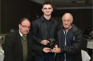  ??  ?? Under-19 player of the year Jack Whelan receiving his award from Declan Crinion and John Keating.