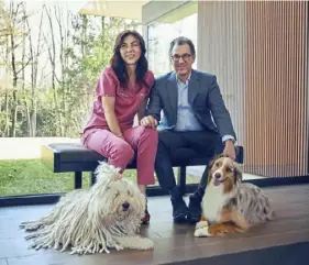  ?? Matt Shuck ?? Veterinari­an Caroline Simard-Swimmer and her husband, Howard Swimmer, with their dogs, Dixie Ray, and Mabel Z. Their business, Pets After Dark, connects pet owners with on-call veterinari­ans after regular office hours.