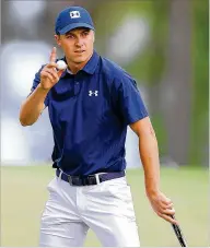  ?? CURTIS COMPTON / CCOMPTON@AJC.COM ?? Jordan Spieth makes a birdie on the 16th hole to go 6-under par during the first round of the Masters at Augusta National Golf Club on Thursday.