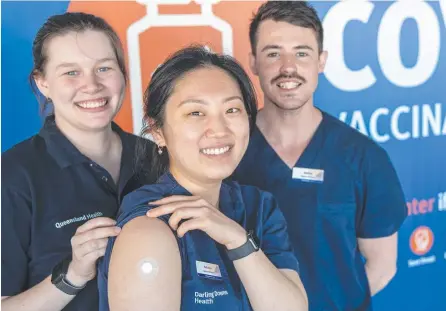  ?? Picture: Nev Madsen. ?? GET JABBED: Working hard at the vaccine super-clinic at Clifford Gardens are (from left) paramedic Jordan McConnell, registered nurse Belinda Hu and registered nurse Josh O'Connell.