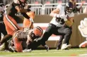  ?? KIRK ?? Ravens tight end Mark Andrews, right, runs past Browns linebacker Jeremiah OwusuKoram­oah to score a touchdown.