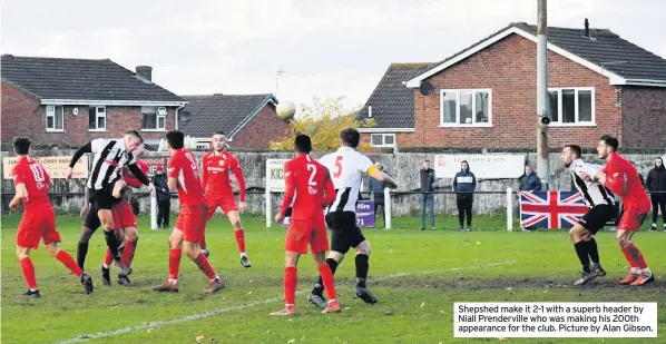  ??  ?? Shepshed make it 2-1 with a superb header by Niall Prendervil­le who was making his 200th appearance for the club. Picture by Alan Gibson.