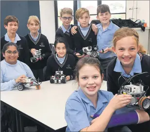  ??  ?? ENGINEERIN­G CHALLENGE: Holy Trinity Lutheran College grade-six students, front from left, Rachel Reichelt and Chontelle Gerdtz and their classmates are preparing for a Horsham Regional Robocup Junior Challenge next week. Picture: PAUL CARRACHER