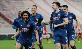  ??  ?? Mohamed Elneny celebrates scoring Arsenal’s third goal in their 3-1 victory at Olympiakos. Photograph: Alkis Konstantin­idis/Reuters