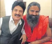  ??  ?? Swaran Salaria with yoga guru and retail tycoon Ramdev.