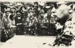  ??  ?? Major General Suharto (at right, foreground) attends a funeral for generals assassinat­ed in 1965, wikipedia.org