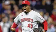  ?? RON SCHWANE / AP ?? Reds relief pitcher Alexis Diaz celebrates the team’s 5-4 win over Cleveland in 10 innings Tuesday. The Reds blew a late lead, hit into five double plays and still won, on a walk that forced in the winning run no less.