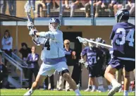  ?? Christian Abraham / Hearst Connecticu­t Media ?? Yale’s Christian Cropp, left, winds up to shoot a goal against Georgetown on Saturday.