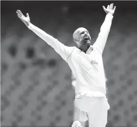  ?? ?? LION –HEARTED! Nathan Lyon spun Australia to a big win over England and reached 400test wickets in the process.