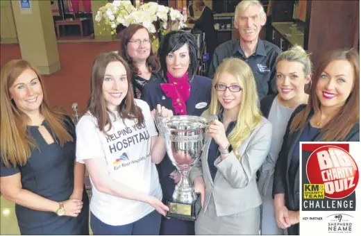  ??  ?? Victoria Adley of East Kent Hospitals Charity dementia appeal and Sophie Richardson of Hallett & Co join event partners to unveil the giant trophy teams will be competing for at the KM Big Charity Quiz