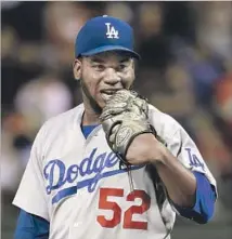  ?? Matt Slocum Associated Press ?? PEDRO BAEZ HELD batters to a .099 average with runners in scoring position, but he had a 20.77 ERA during Dodgers’ slump.