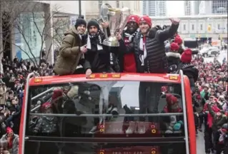  ?? CHRIS YOUNG, THE CANADIAN PRESS ?? From left, TFC players Sebastian Giovinco, Victor Vazquez, Jozy Altidore and Michael Bradley hold up the MLS Trophy as the team celebrates its Major League Soccer title in Toronto on Monday.