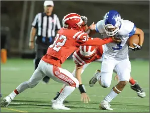  ?? BEA AHBECK/NEWS-SENTINEL ?? Lodi's Jose Bravo tackles Bear Creek's Brian Adams during Lodi’s victory at the Grape Bowl in Lodi on Sept. 27.