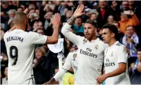  ?? Reuters ?? Real Madrid’s Sergio Ramos celebrates a goal with teammates during the La Liga mtach against Real Valladolid. —